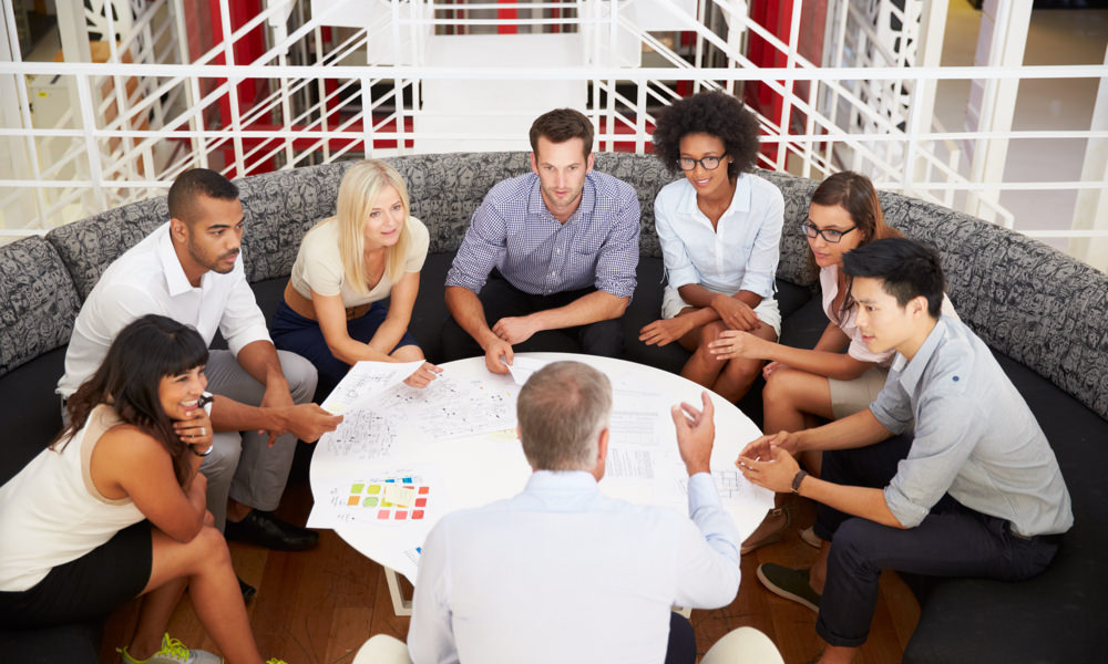 group of people talking at a table